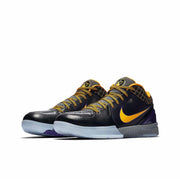 Black and purple Nike Kobe 4 basketball sneakers with gold Swoosh branding and gold-accented laces.