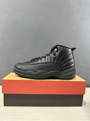 Side view of a black high-top sneaker showing the padded collar, textured forefoot, and sculpted sole.
