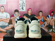 Rear view of the shoes showing the heel panels and signatures