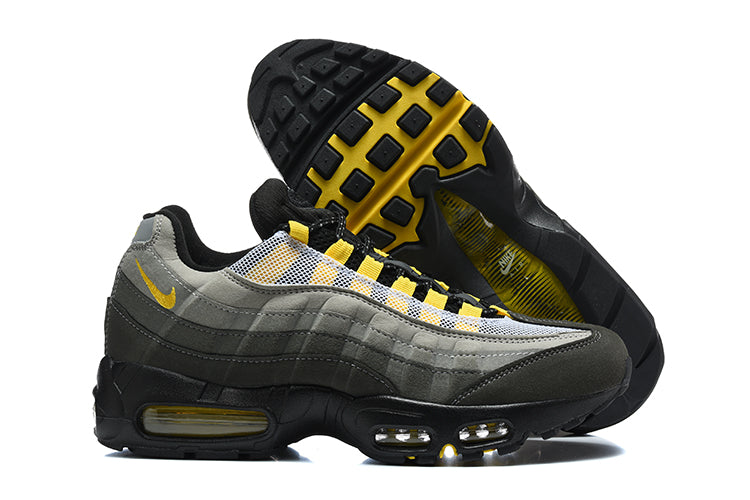 Nike Air Max 95 TT sneakers showing the grey and charcoal upper, yellow accents and outsole.