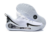 Side view of a white basketball sneaker with black accents, a patterned upper, a decorative heel panel, and a textured outsole.