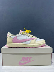 Side profile of the cream, white and pink low-top sneaker displayed on its box.