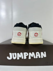 Rear view showing white heel panels, black collars, and red embroidered heel details.