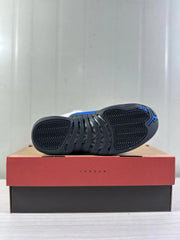 Bottom view showing the black outsole traction pattern with blue Jordan details.