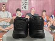 Rear view showing the padded black collars and textured rubber outsoles.