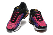 Front views of a pair of black sneakers with pink and purple gradient panels and black laces.