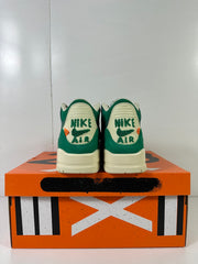 Rear view of the pair showing embroidered Nike Air heel branding and orange accents.