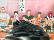 Side view of a black Nike basketball sneaker with a tonal Swoosh and textured side panel.