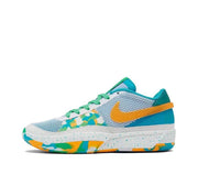 Side view of a light blue, green, orange, and white low-top basketball sneaker with a speckled midsole.