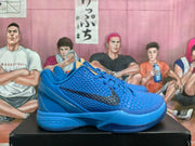 Side view showing a blue textured upper, black Swoosh, and Nike Zoom midsole marking
