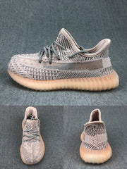 Side, top, and heel views of the gray knit-style sneaker with a translucent side stripe and ribbed sole.