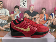 Side view of a red Nike basketball sneaker with a gold Swoosh, black midsole, and textured red overlays.