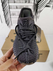 Top view showing the lace arrangement, textured upper, padded collar, and rounded toe.