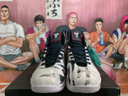 Front view showing dark laces, patterned toe panels, basketball graphics and number 10 details.