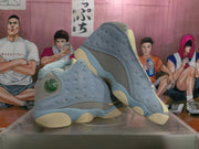 Angled view of the pair highlighting the perforated side panels, circular side detail, and layered sole
