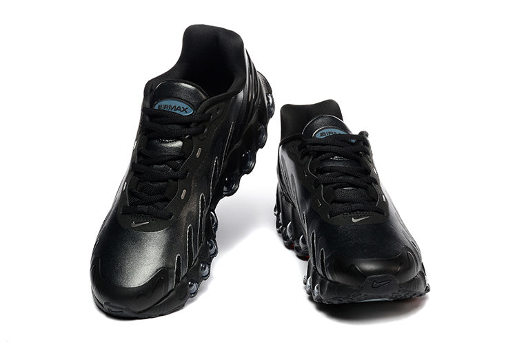 Pair of black Nike Air Max DN sneakers shown from the front