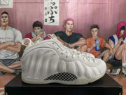 Side view showing the molded white upper, raised side details, Nike swoosh and checkerboard-patterned side insert.