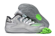 Silver Nike KD 18 sneaker with a patterned outsole and green details.