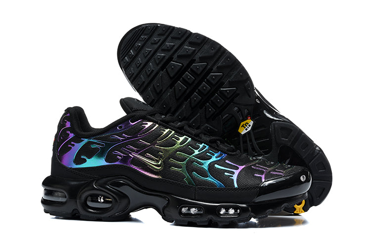 Black Nike Air Max Plus sneakers shown from the side and underside, with multicolor iridescent-style overlays.