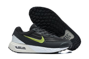 Nike Air Max Verse sneaker side and outsole view, showing the black tread, white midsole, and volt-green Swoosh.