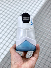 Rear view showing the black heel tab, blue branding, and blue outsole.