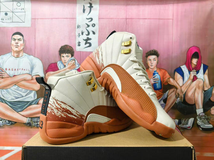 Pair of cream and brown Jordan 12 high-top sneakers shown from the side.