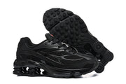 Black Nike Shox Ride 2 sneakers shown from above alongside the patterned outsole.