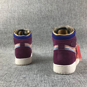 Rear view of the pair showing purple heel panels, blue collar sections, and light outsoles.