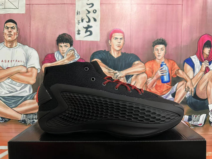 Side view of a black high-top Adidas basketball shoe with red laces and textured side panel.