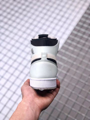 Rear view of the high-top sneaker showing the white heel, black collar trim, and white outsole.
