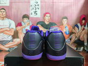 Rear view showing the black heel panels, purple detailing, and heel logos.