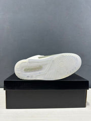 Bottom view showing the translucent outsole and circular traction pattern.