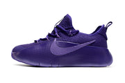Tonal purple sneaker shown in side profile.