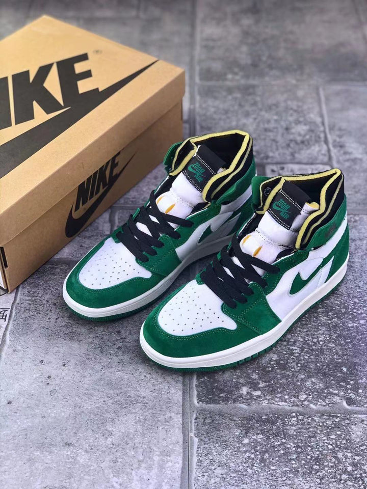 Pair of green, white, black, and yellow high-top sneakers beside a Nike shoebox.