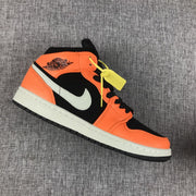 Single sneaker in side profile highlighting the orange overlays, black panels, and light-colored Swoosh.