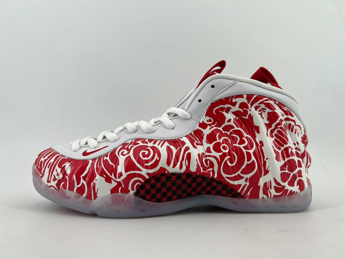 White and red high-top sneaker with a red graphic upper and translucent outsole.