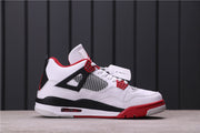 Side profile showing the white upper, black midsole section, red outsole accents, and heel Air unit.
