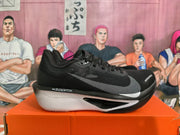 Side view of black Nike ZoomX running shoe with gray Swoosh and white midsole