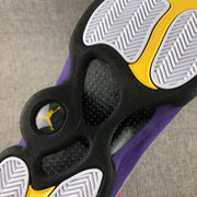 Close-up of the outsole with white tread, black sections, and yellow detailing