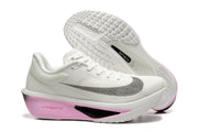 Side and outsole views of white Nike Zoom Fly 6 shoes with pink and black accents.