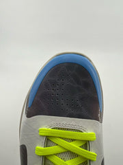Top-down view of the perforated toe and neon yellow laces