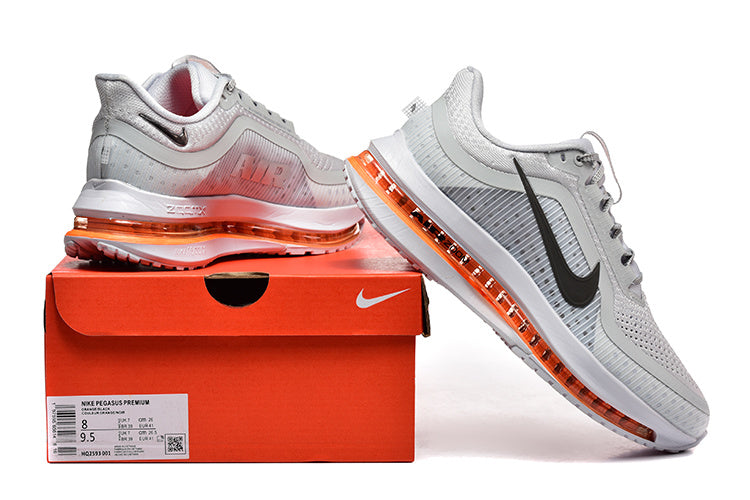Nike Pegasus Premium shoes in grey and orange displayed with an orange Nike shoe box; box label shows sample sizes 8 and 9.5.