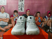 Front view of the pair showing the lace-up construction, mesh-like upper panels, and rubber toe outsoles.