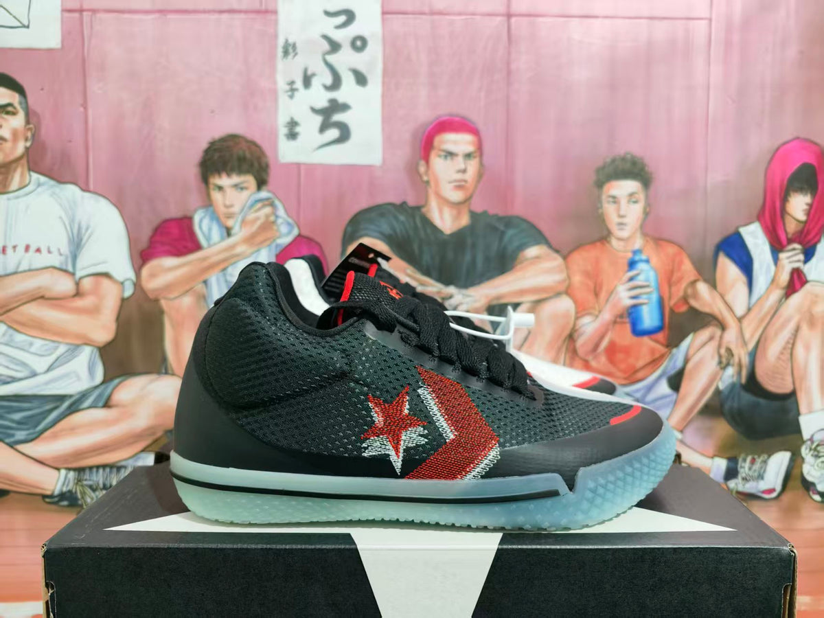 Black Converse basketball shoe with a red star-and-chevron side graphic and pale outsole