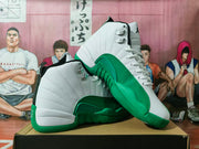Angled view of the white and green high-top sneakers