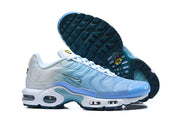 Light blue and white Nike Air Max Plus sneakers shown from the side with the outsole visible.