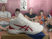 Side profile of a white ASICS basketball sneaker with red branding