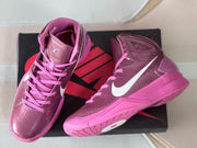 Pair of mauve and pink high-top basketball shoes shown from above and the side.