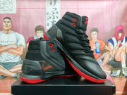 Angled view of the black and red basketball sneakers showing the lace system, padded collars, and textured side panels.