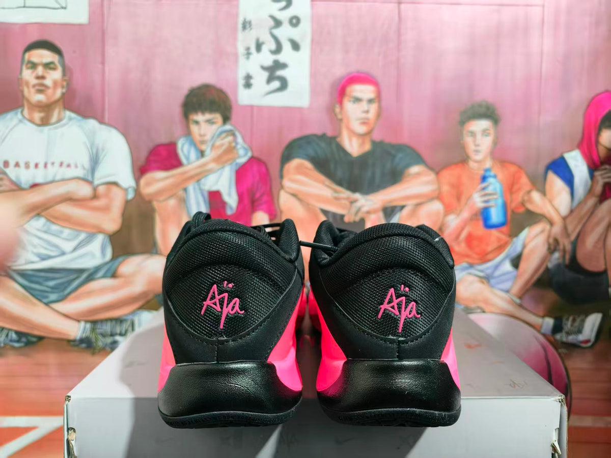Rear view of pink and black Nike basketball sneakers showing black padded heels and pink heel branding.
